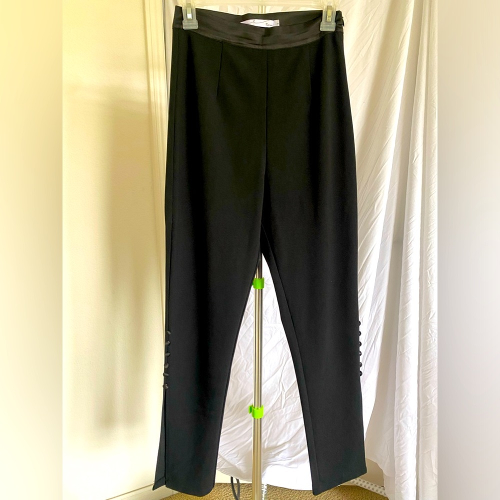 Women’s polyester pants with calf/ankle slit and button detail. Worn twice !